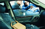 Thieves Looking Into Automobile